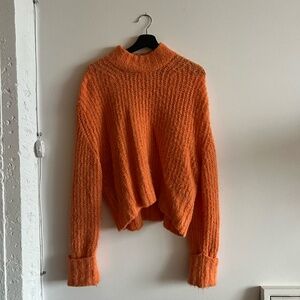 fuzzy orange sweater